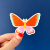 Clear Vinyl Butterfly Sticker. On a blue background. Perfect for journals and water bottles. Nutmeg and Arlo 