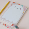 A cute ghost notepad with a pencil and washi tape next to it - Nutmeg and Arlo