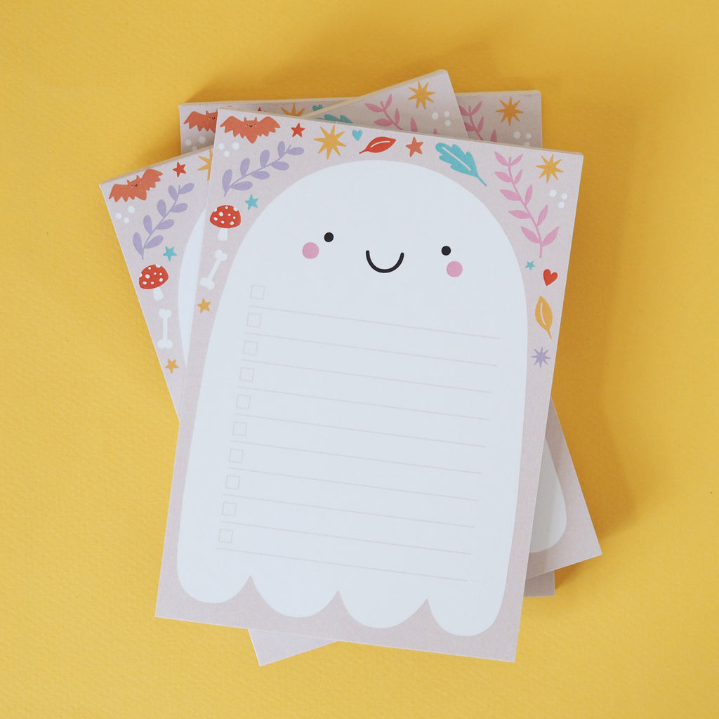 A stack of 3 cute ghost notepads on a vibrant yellow background - Nutmeg and Arlo