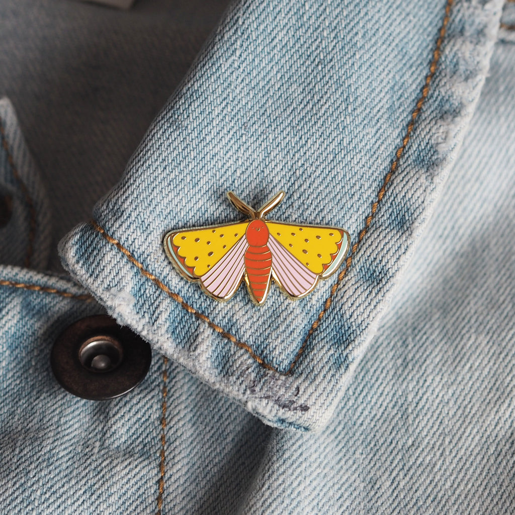 Pretty moth enamel pin on a denim jacket - nutmeg and arlo